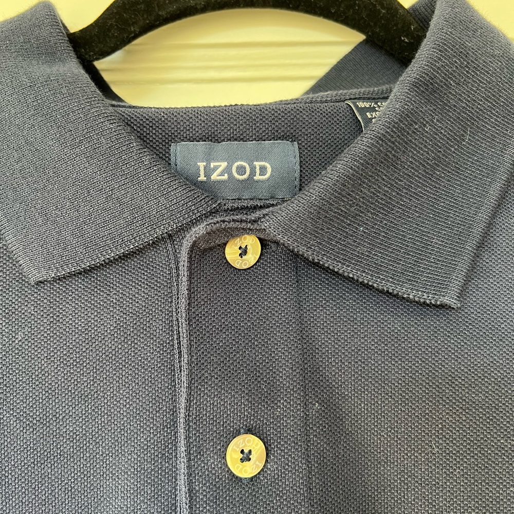 Polo shirt in navy. Izod 100% cotton. Never worn, but no tags